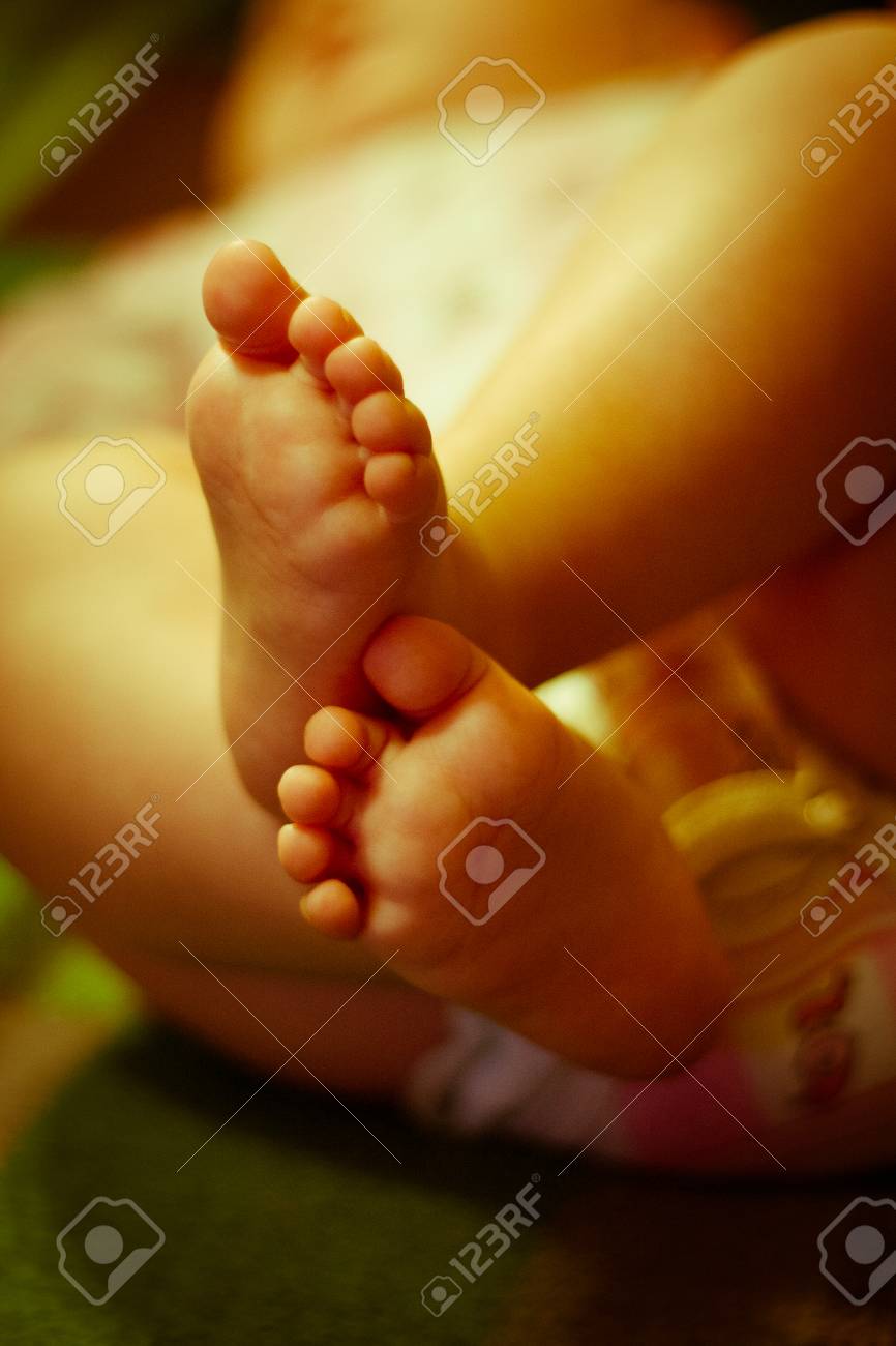 Small beautiful legs of a newborn baby stock photo 39015257