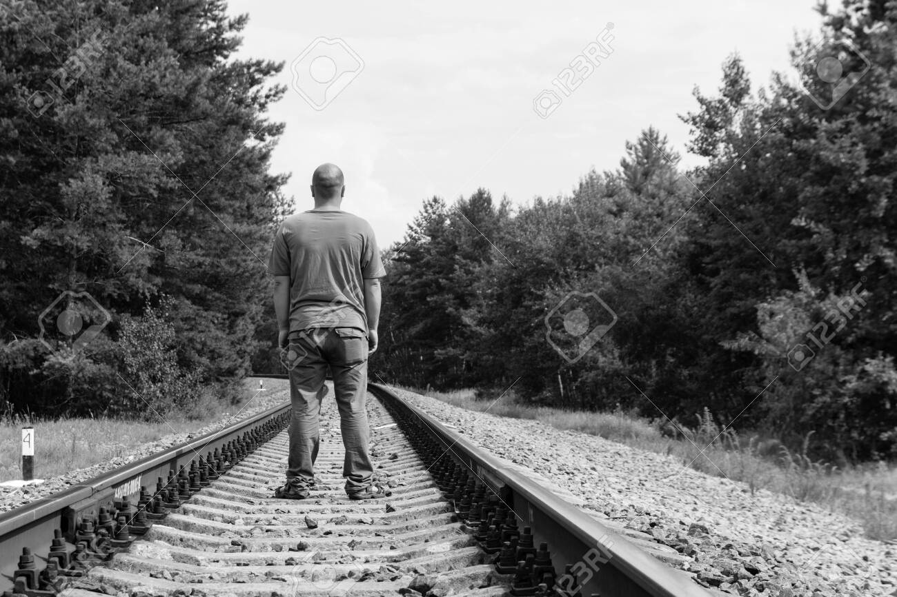 Lonely Man Walking On A Railway Track Black And White Tone Stock Photo Picture And Royalty Free Image Image