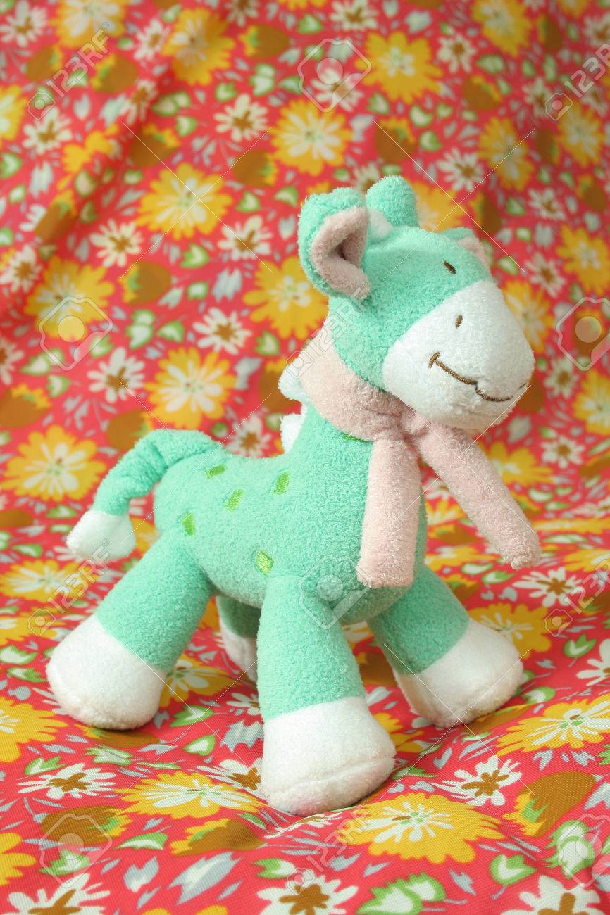 green giraffe stuffed animal
