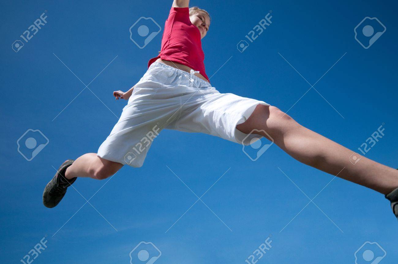 Beautiful young woman jump into blue sky on sunny summer day - 8593858 Beautiful young woman jump into blue sky on sunny summer day - 8593858