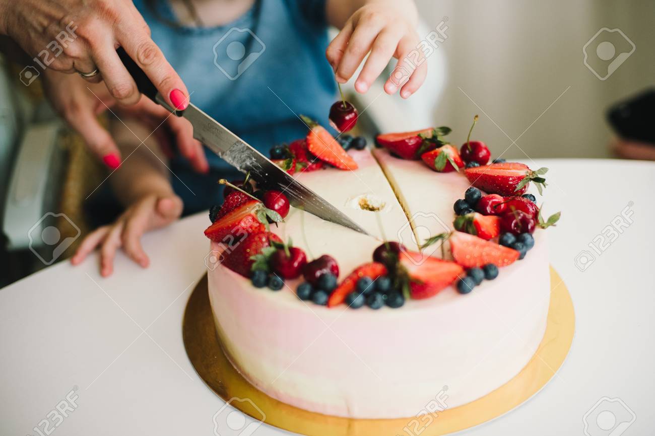 cutting baby cake with