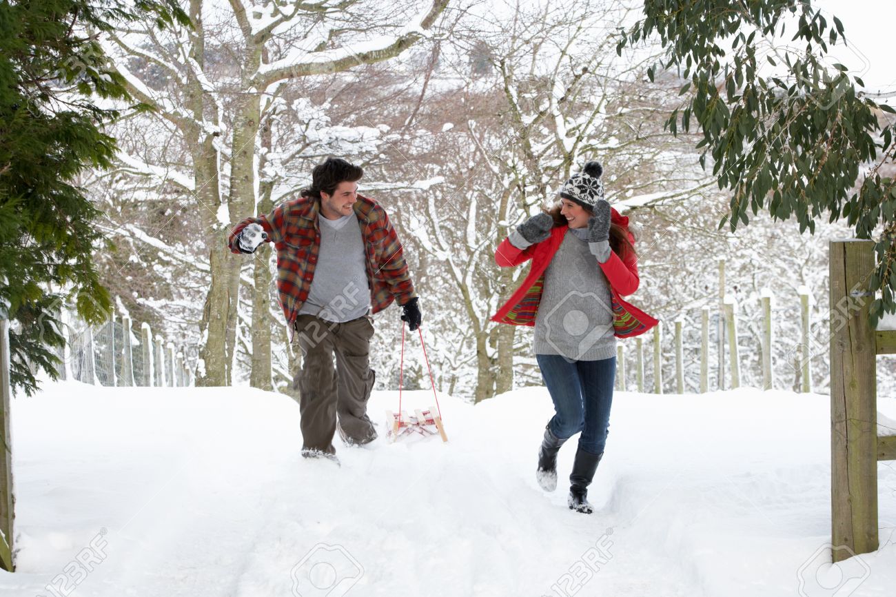 Young Couple Having Snowball Fight Stock Photo, Picture and Royalty Free  Image. Image 11246860.