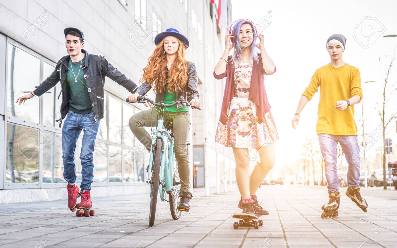 Group of teens making activities in an urban area. concept about youth and friendship - 54083734 Group of teens making activities in an urban area. concept about youth and friendship - 54083734