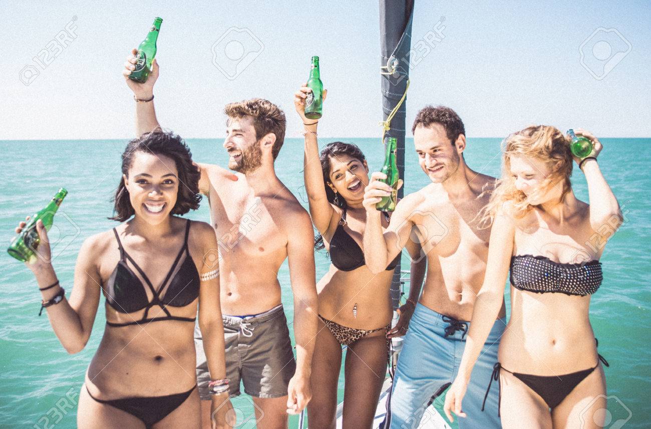 Friends making party on the boat - 65089529 Friends making party on the boat - 65089529