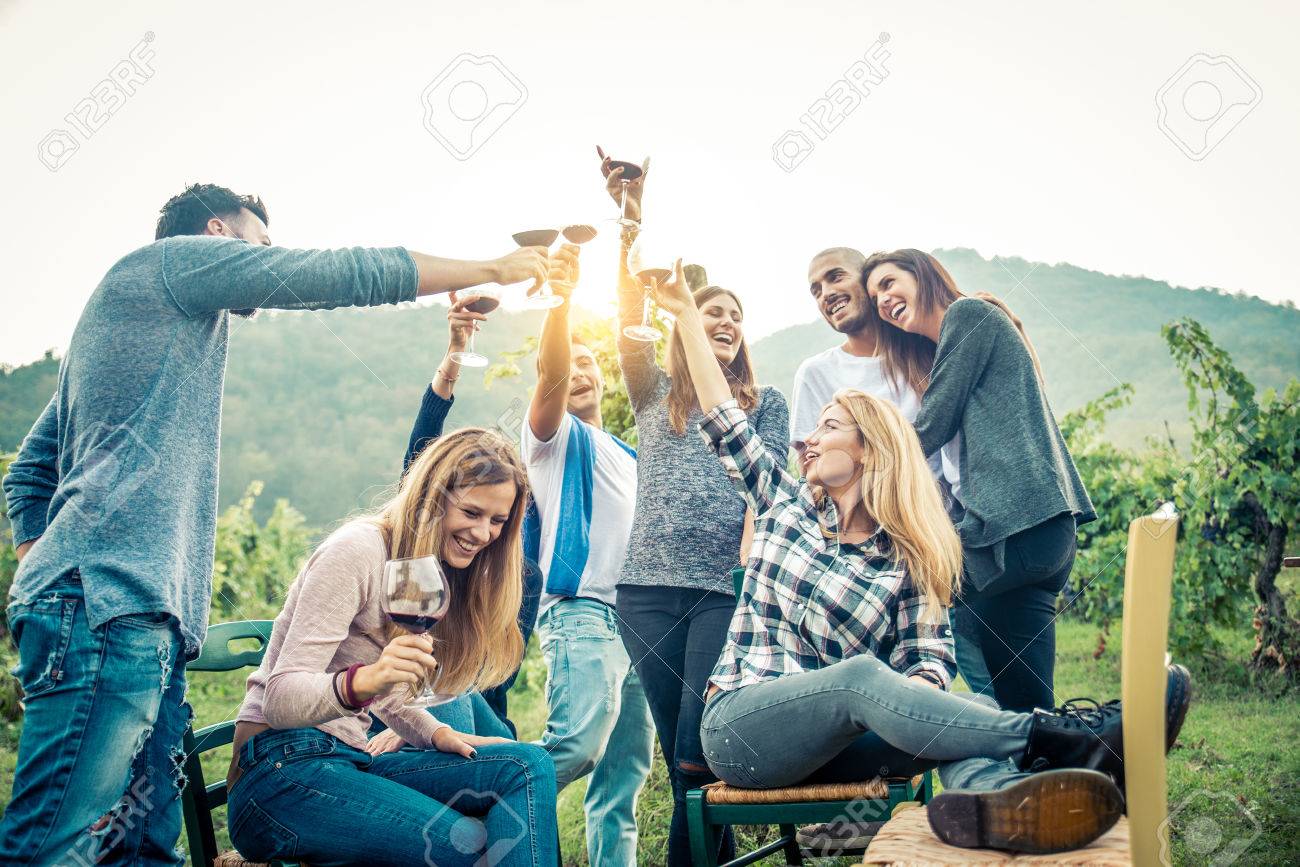 Group of friends at restaurant outdoors - People having dinner in a home garden - 81940596 Group of friends at restaurant outdoors - People having dinner in a home garden - 81940596