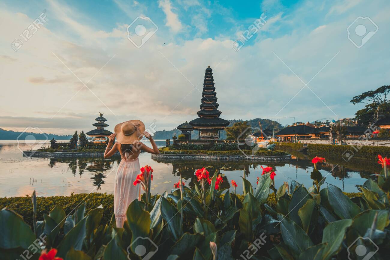 Beautiful Girl Visiting The Ulun Danu Bratan Temple In Bali