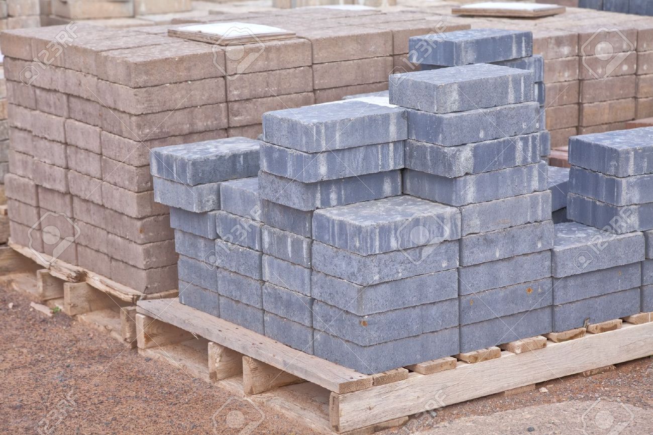 Stacks Of Various Colored Concrete Pavers (paving Stone) Or Patio Stacks of various colored concrete pavers (paving stone) or patio blocks organized on wooden - Stacks Of Various Colored Concrete Pavers (paving Stone) Or Patio