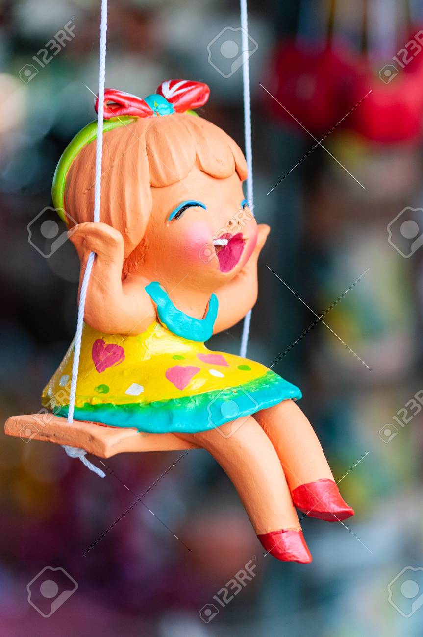 doll on a swing