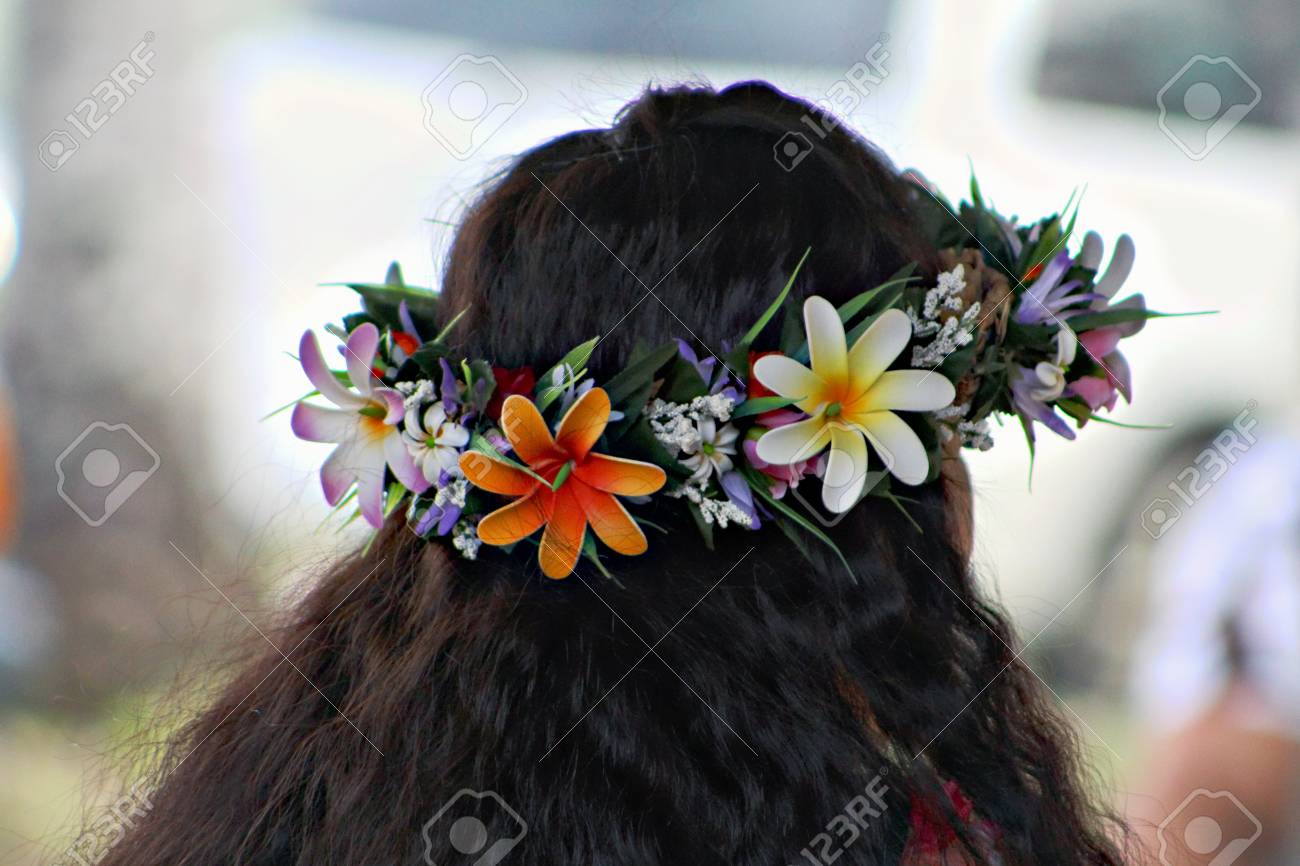 Tiara Made Of Colorful Flowers On Top Of Long Curly Black Hair