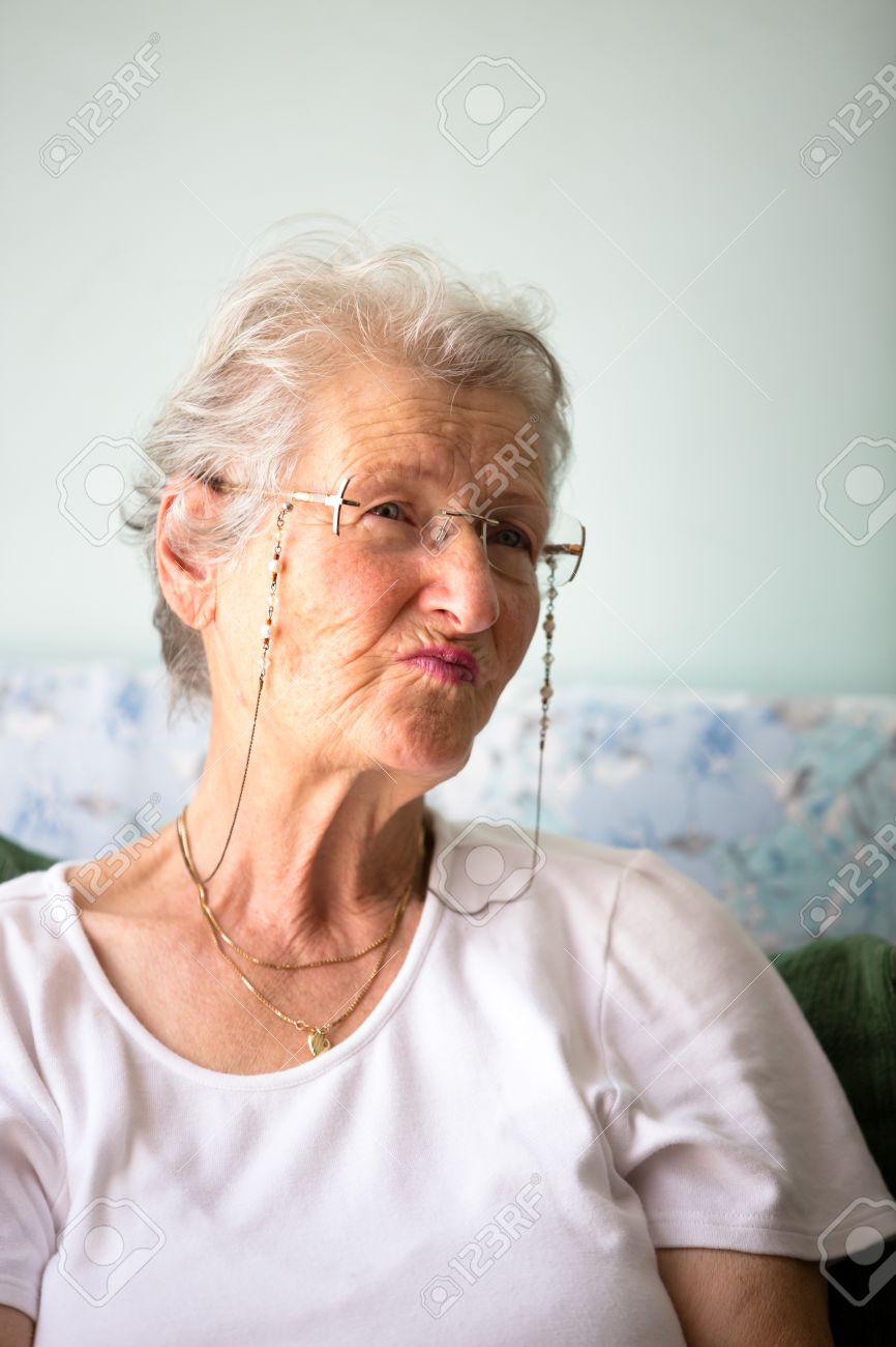 white hair old lady giving pernickety look stock photo picture and
