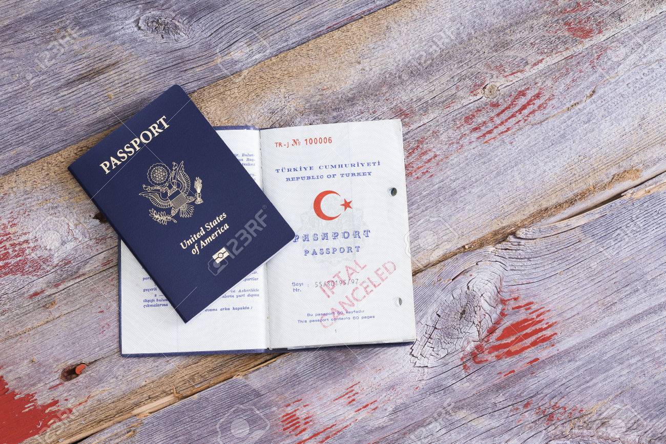 https://previews.123rf.com/images/oocoskun/oocoskun1403/oocoskun140300141/27012173-an-american-and-turkish-passport-lying-on-an-old-wooden-table-with-the-turkish-passport-opened-to.jpg