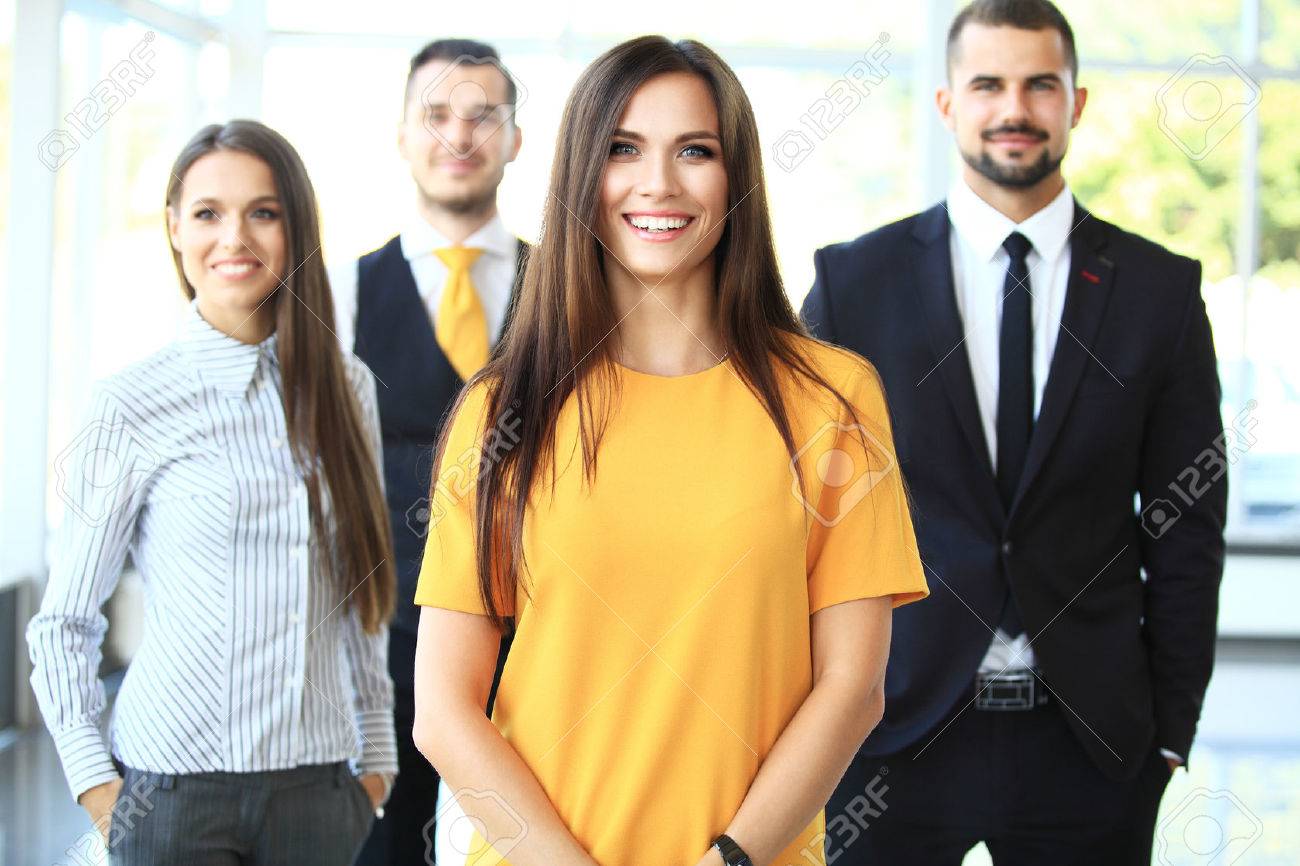 Successful business team smiling at the office - 48074233 Successful business team smiling at the office - 48074233
