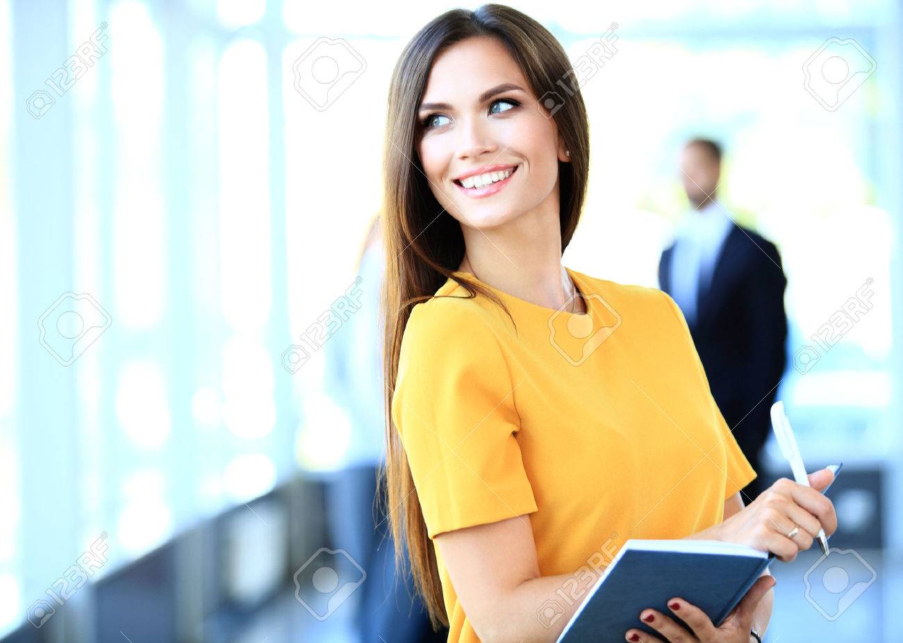 business woman with her staff, people group in background at modern bright office indoors - 48284611 business woman with her staff, people group in background at modern bright office indoors - 48284611