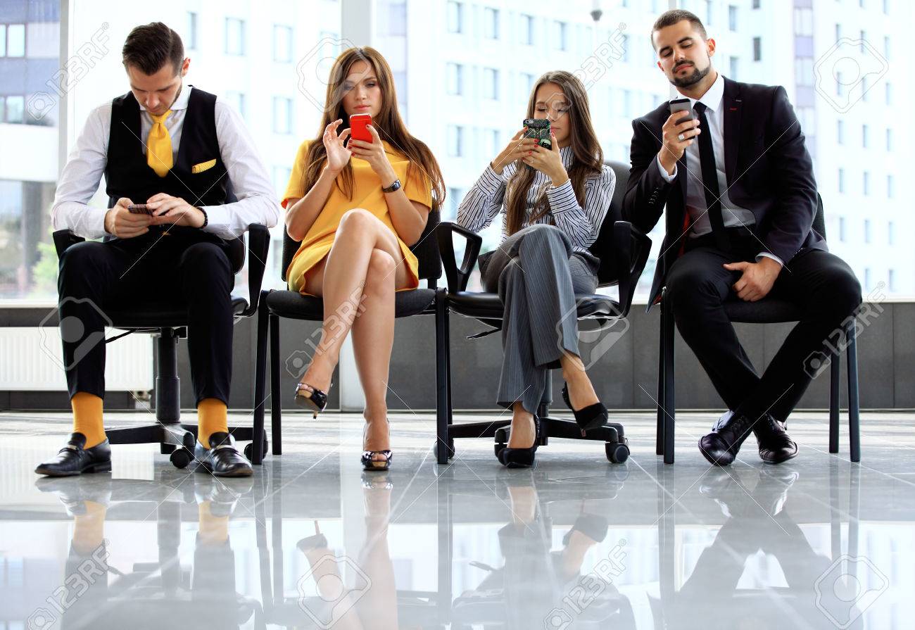 Business people waiting for job interview in office - 50162936 Business people waiting for job interview in office - 50162936