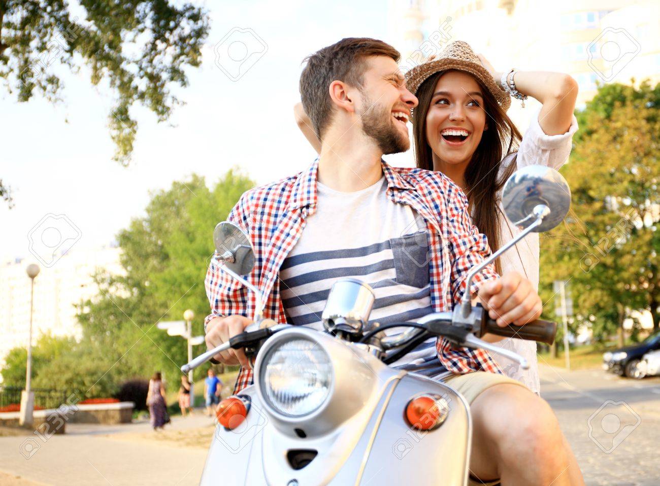 Couple in love riding a motorbike - 53536911 Couple in love riding a motorbike - 53536911