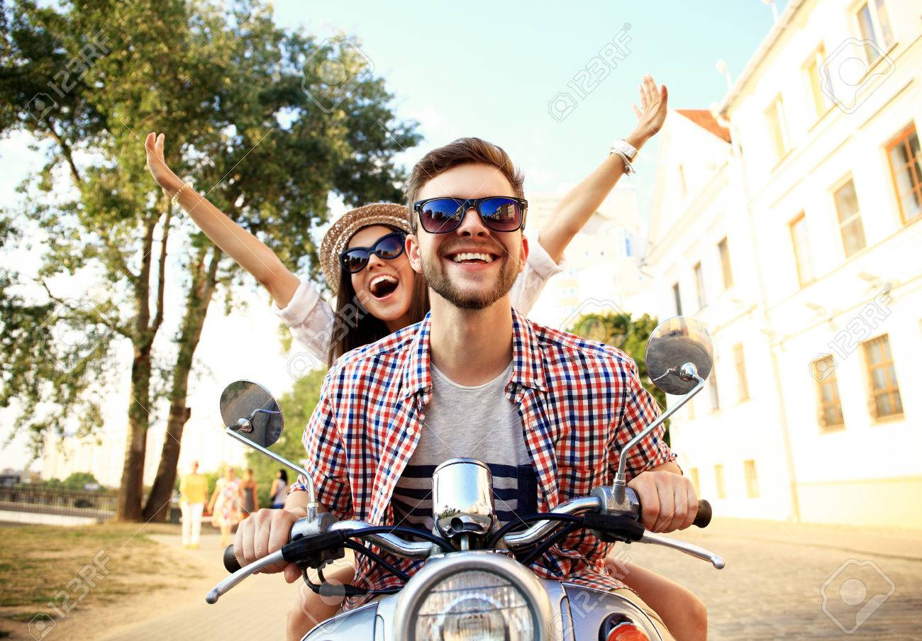 Couple in love riding a motorbike - 53536992 Couple in love riding a motorbike - 53536992