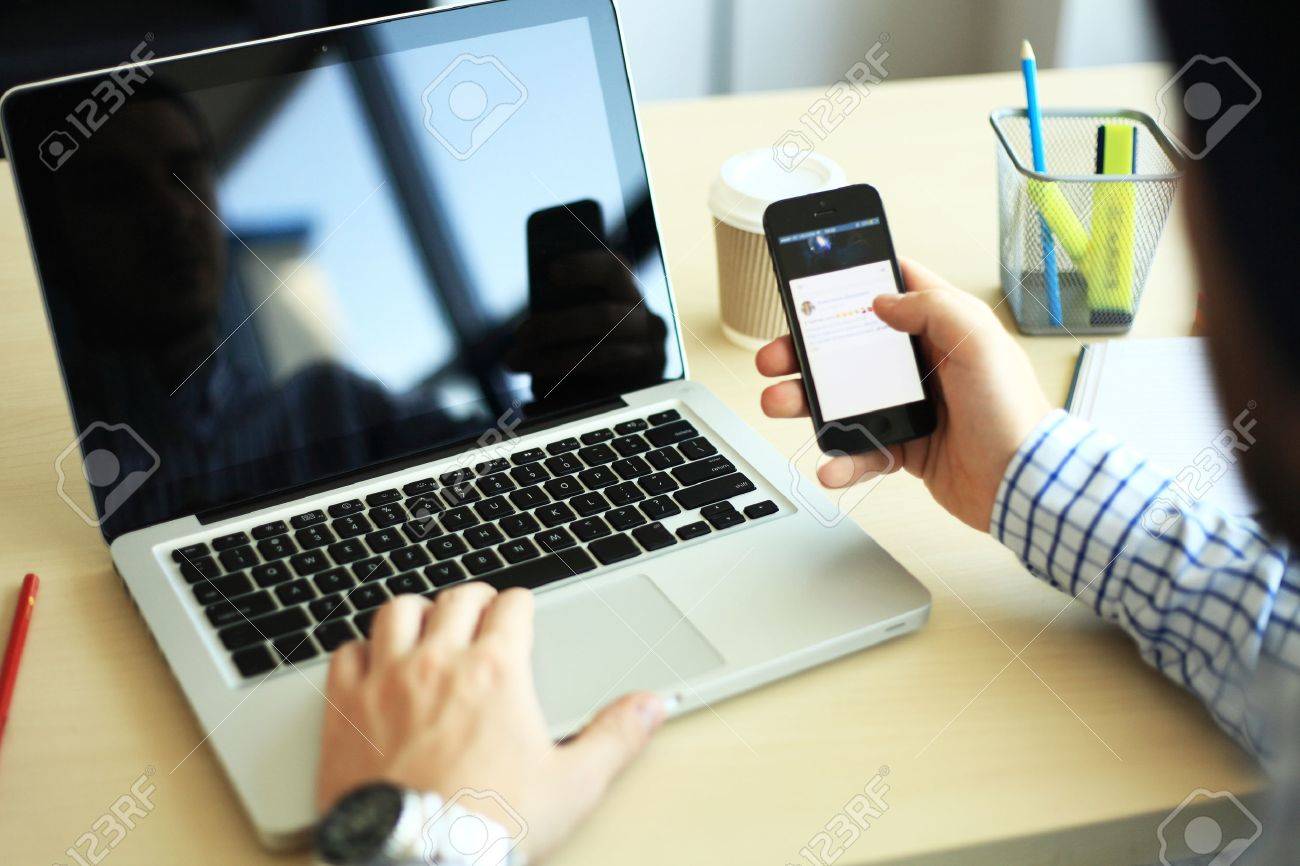 business man using internet on smart phone and laptop - 60697498 business man using internet on smart phone and laptop - 60697498