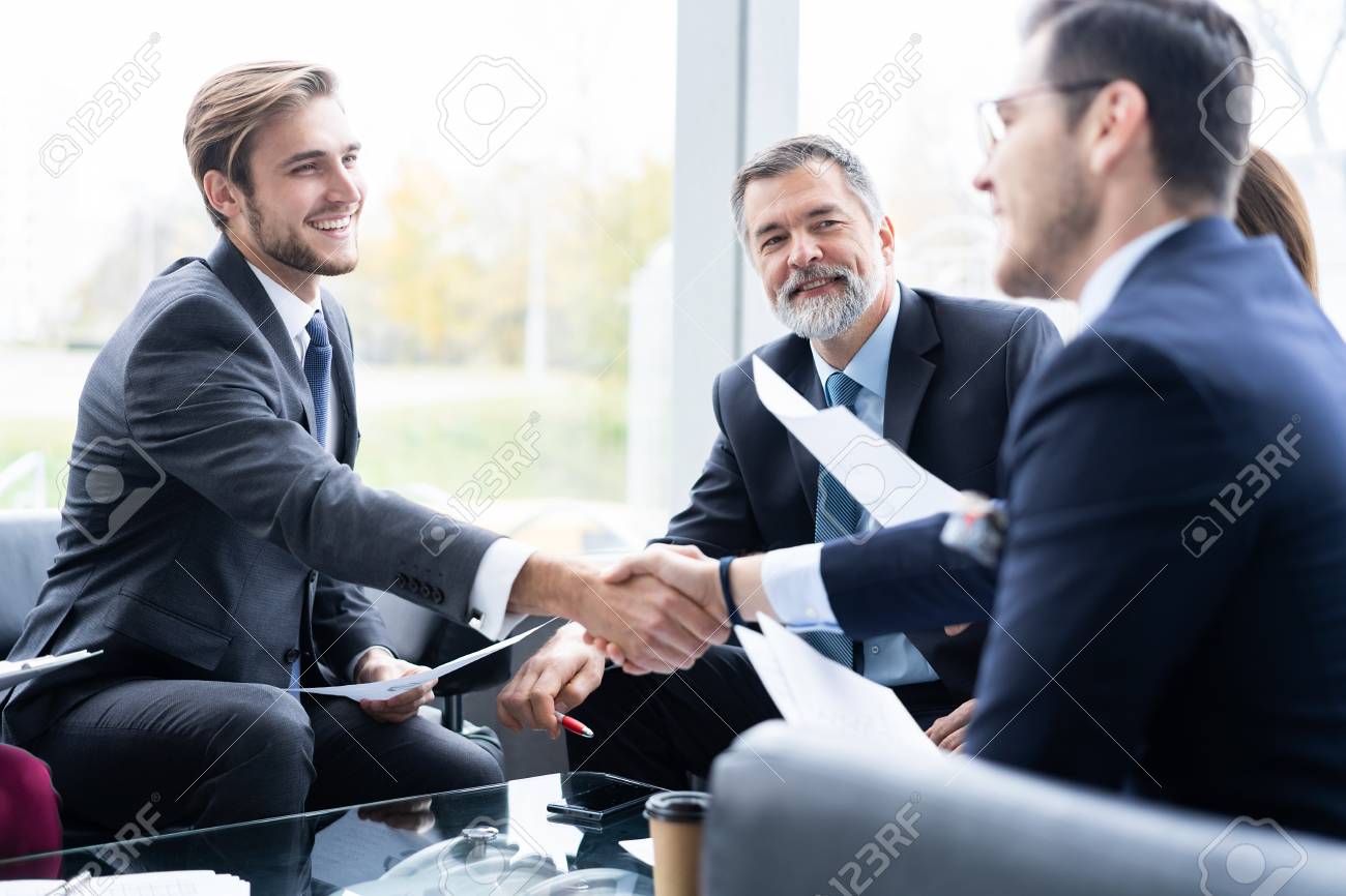 Business People Shaking Hands Finishing Up A Meeting Handshake