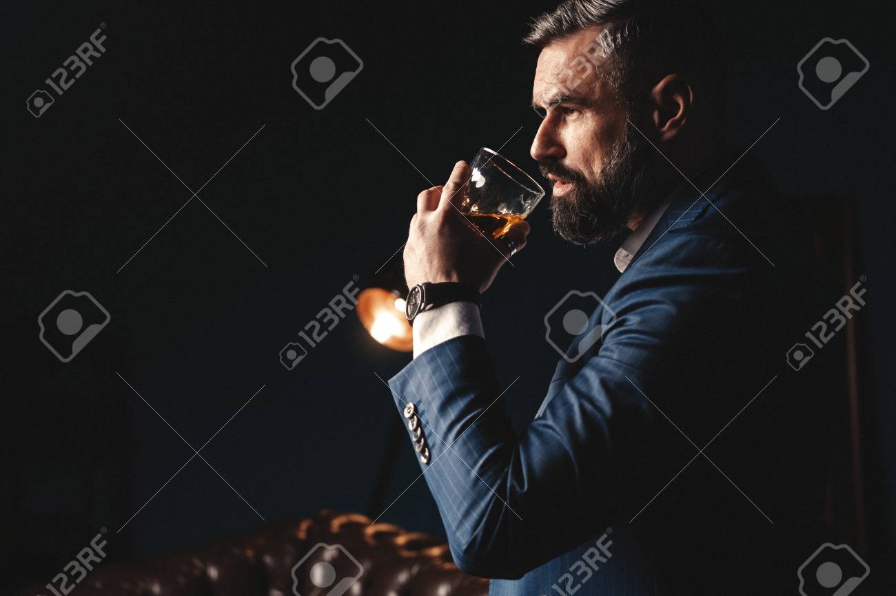 Degustation, tasting. Man with beard holds glass of brandy. Tasting and degustation concept. Bearded businessman in elegant suit with glass of whiskey - 117091809 Degustation, tasting. Man with beard holds glass of brandy. Tasting and degustation concept. Bearded businessman in elegant suit with glass of whiskey - 117091809