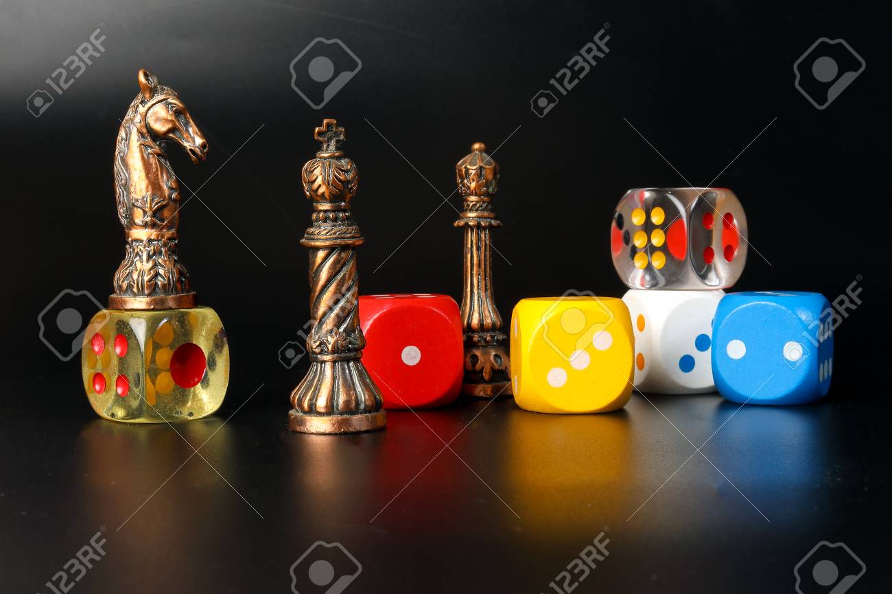 Colourful playing gaming dice transparent metal chess pieces on black background - 95212297 Colourful playing gaming dice transparent metal chess pieces on black background - 95212297