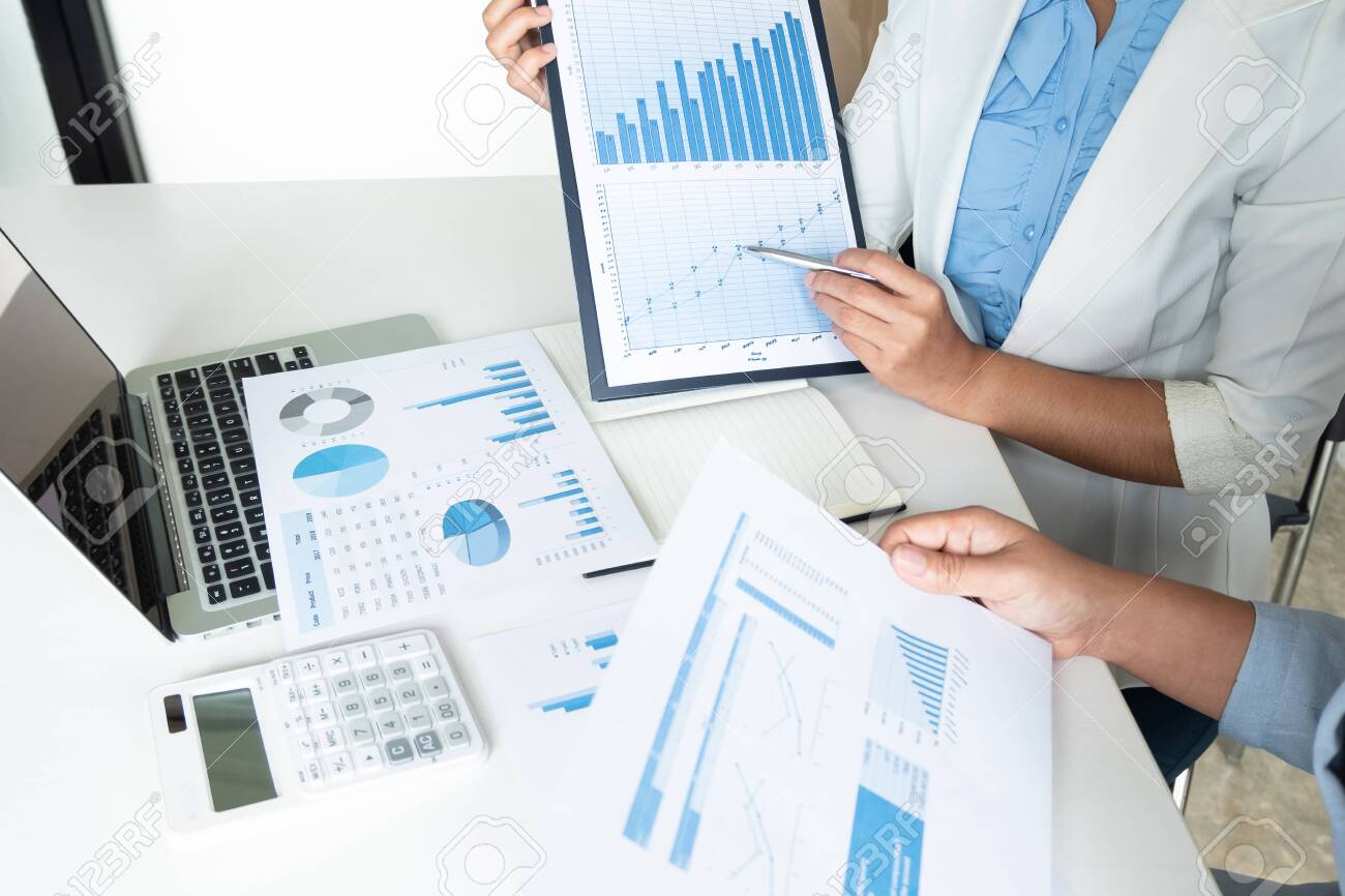 Two Bussiness Leader Women Discussing The Charts And Graphs Showing The Results. Stock Photo, Picture And Royalty Free Image. Image 126625152.