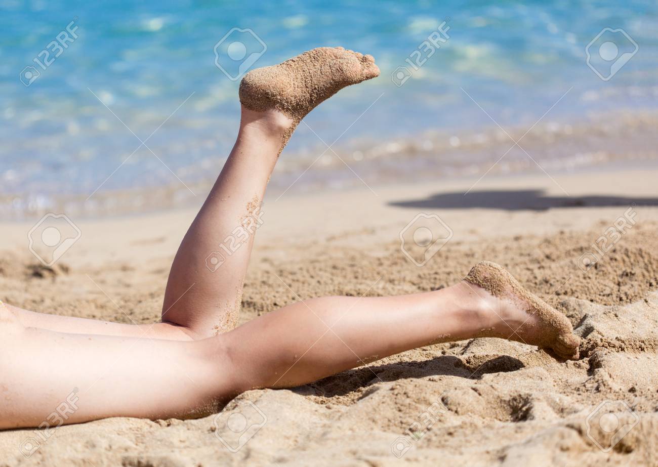 Woman On The Sandy Beach Stock Photo