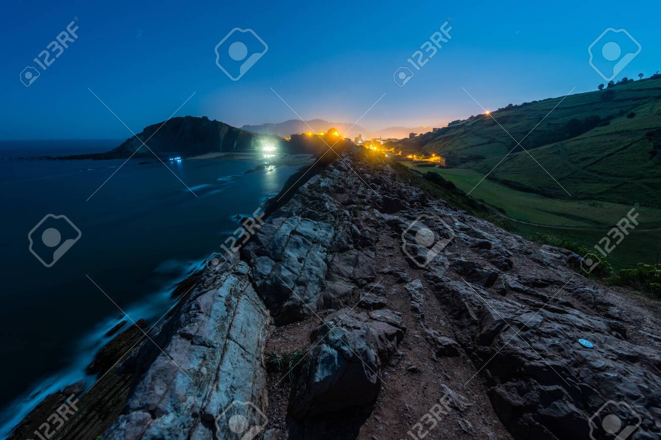 Night View Of The Cliff With Low Tide And The Light Of The Full Stock Photo Picture And Royalty Free Image Image