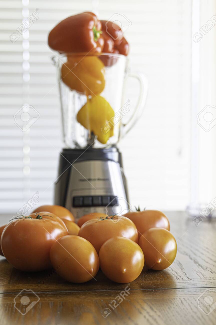 Tomatoes And Bell Peppers With Blender In Kitchen Stock Photo Picture And Royalty Free Image Image 129730349