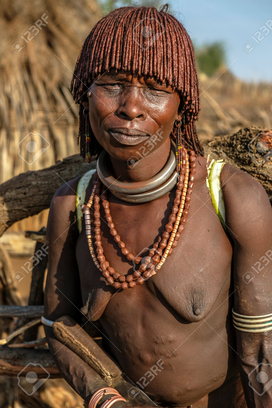 104860891-turmi-ethiopia-january-25-unidentified-hamer-tribe-woman-hamer-woman-usually-comb-their-hairs-with-s.jpg