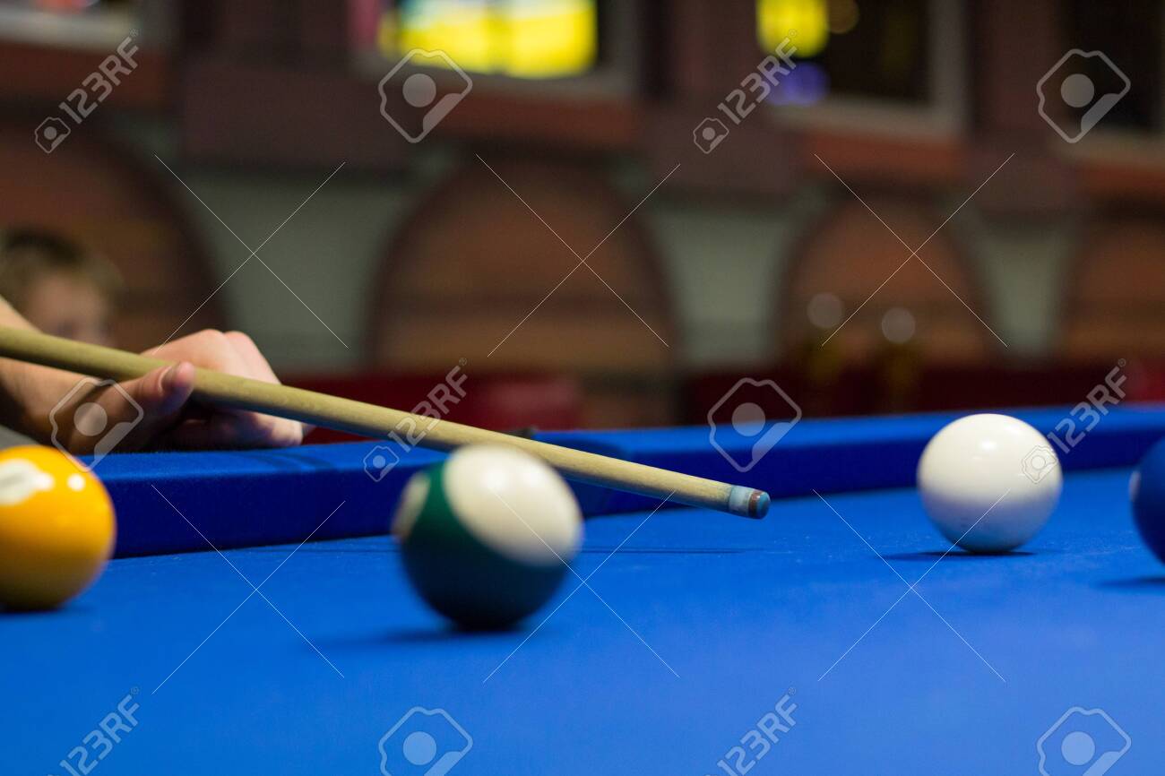 Billiard Pool Game In Progress Player Aims To Shoot Balls With Stock Photo Picture And Royalty Free Image Image