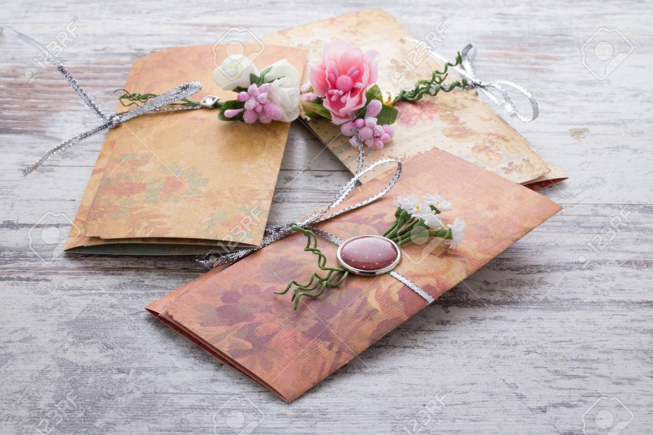 handmade wedding invitations made of paper pver wooden vintage handmade wedding invitations