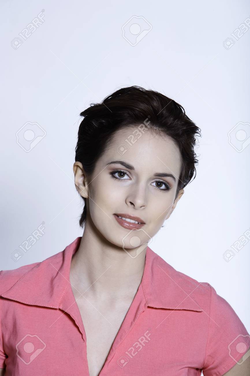 Studio Shot Portrait On Grey Background Of A Beautiful Smiling