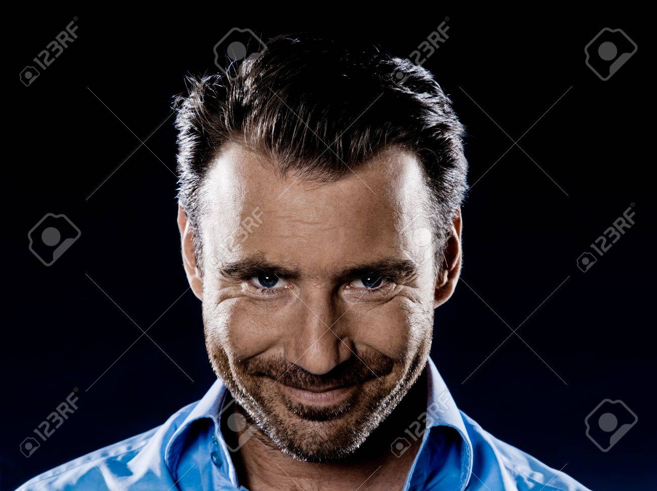 one caucasian man smiling sneaky stubble malicious portrait isolated studio on black background - 11752842 one caucasian man smiling sneaky stubble malicious portrait isolated studio on black background - 11752842