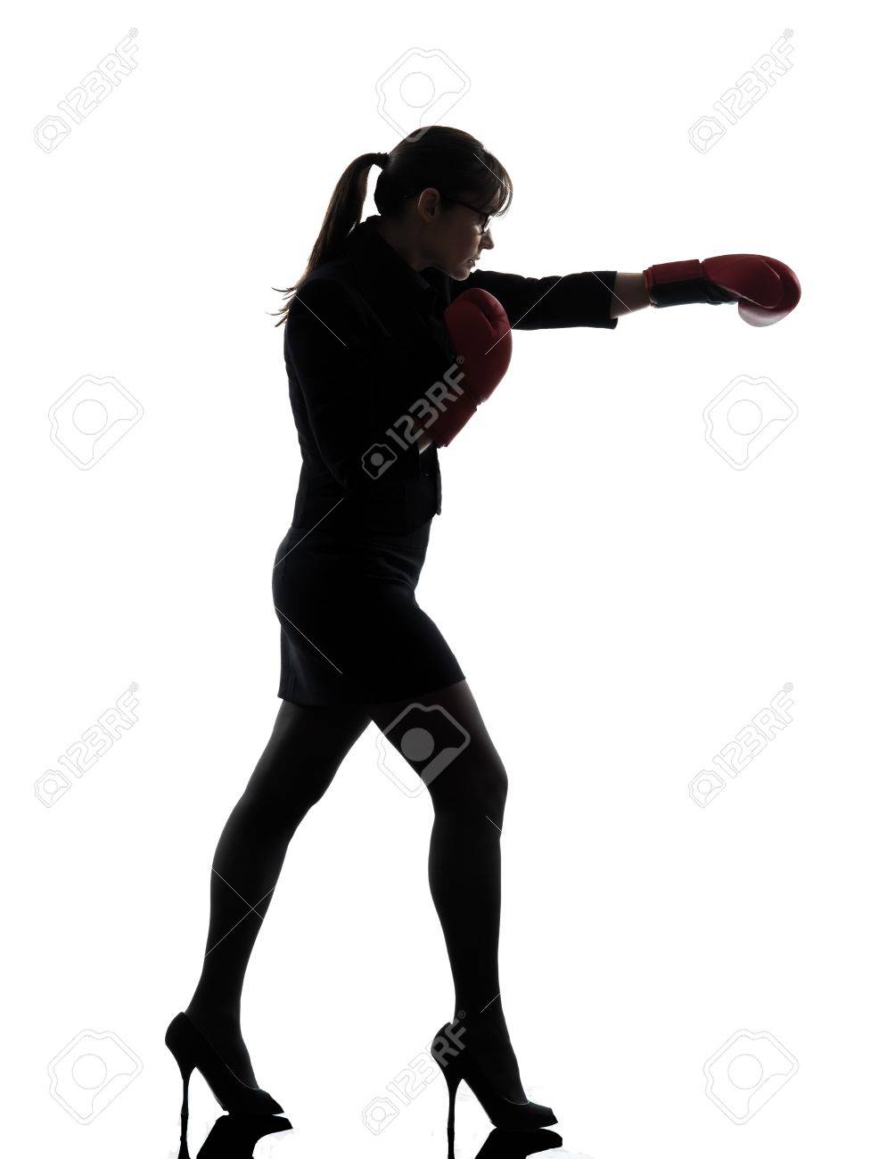 one business woman punch g with box g gloves silhouette studio