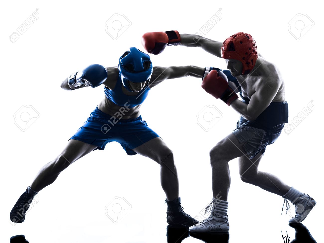 one woman boxer boxing one man kickboxing in silhouette isolated