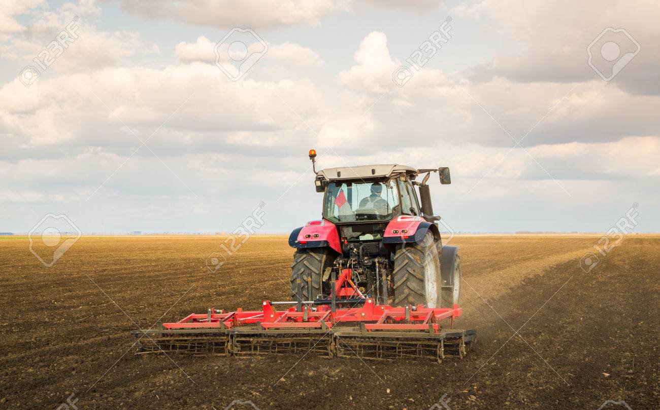 Farmer In Tractor Preparing Land With Seedbed Cultivator Stock Photo Picture And Royalty Free Image Image