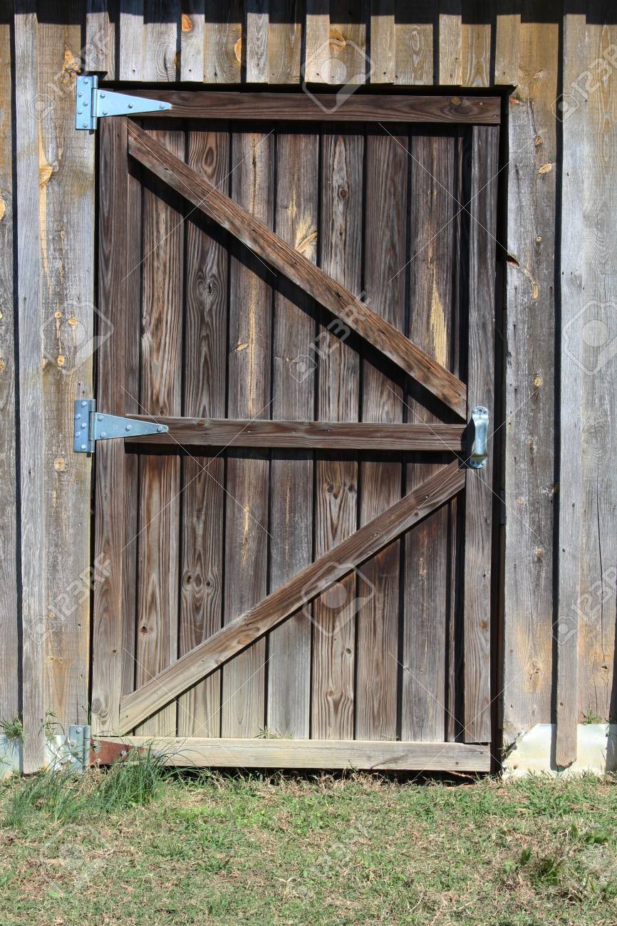 Weathered Wood Door To A Barn Stall