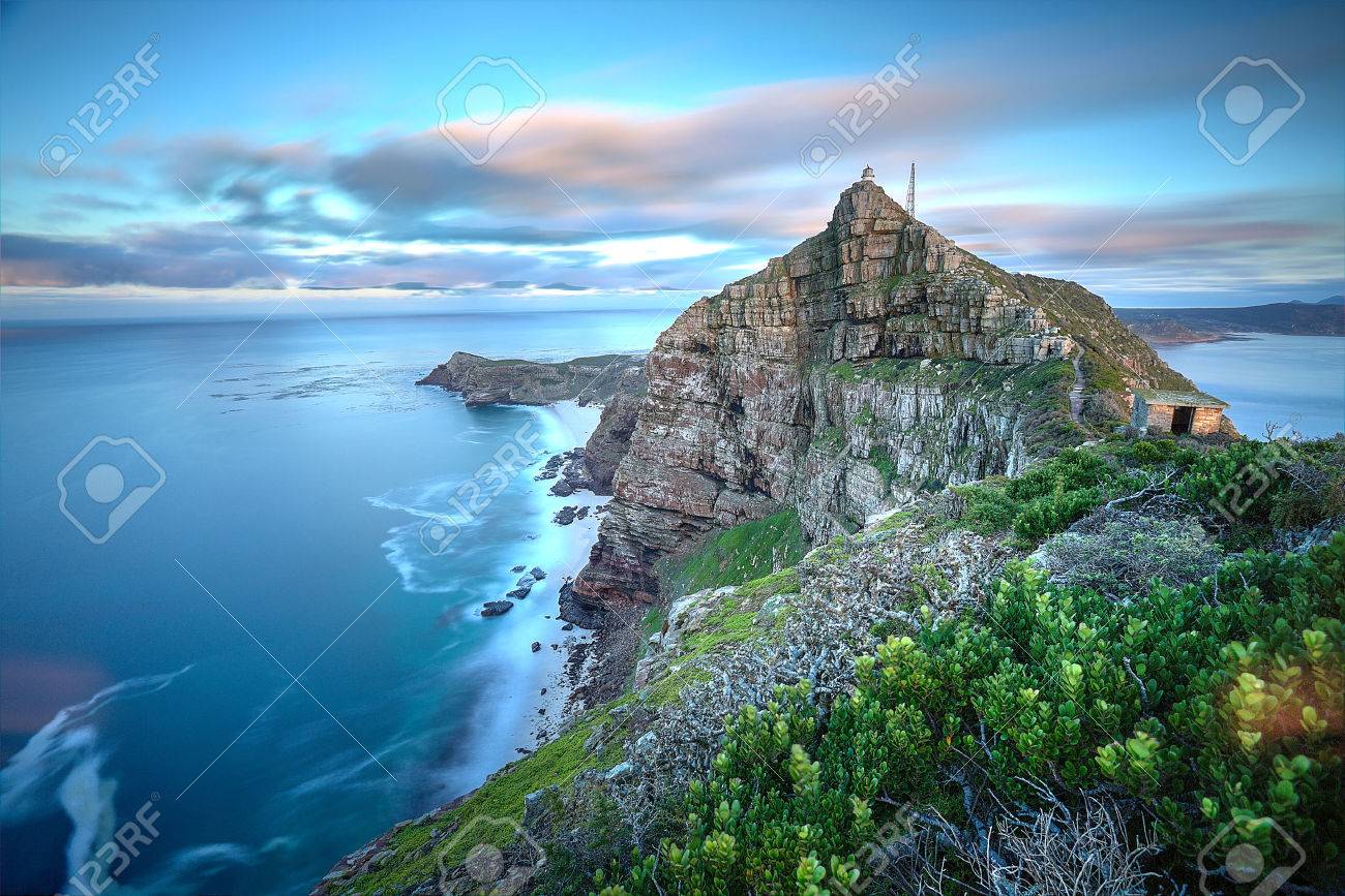 Cape Point, South Africa as time stands still - slight movement in the water and clouds as the sun rises in the back There - 28070830 Cape Point, South Africa as time stands still - slight movement in the water and clouds as the sun rises in the back There - 28070830