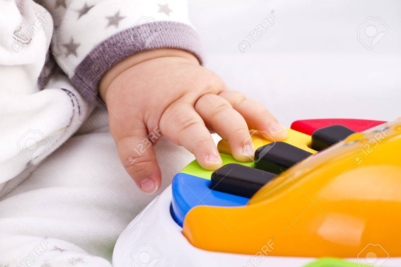 Little Baby Hand Pianist Plays On A Colorful Toy Piano Stock Photo Picture And Royalty Free Image Image Little Baby Hand Pianist Plays On A Colorful Toy Piano Stock Photo Picture And Royalty Free Image Image