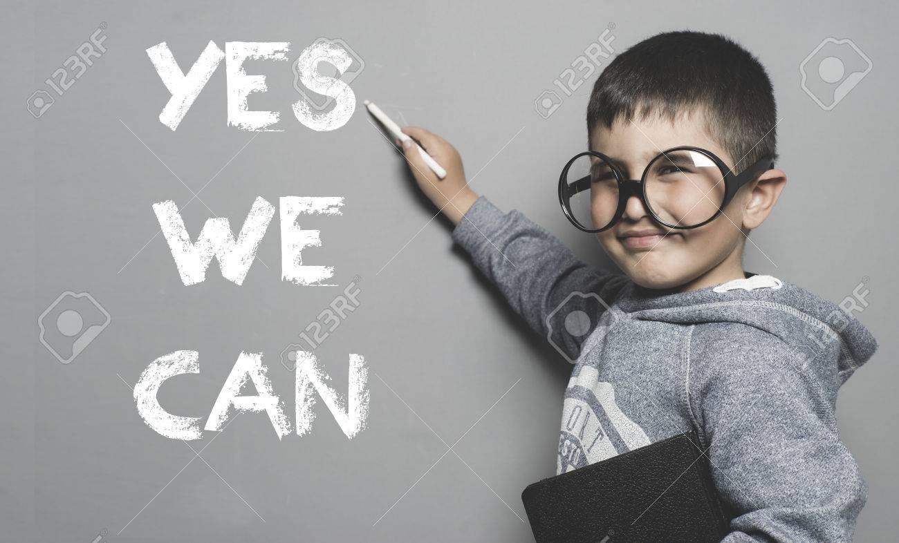 schoolboy with goggles and funny gesture writing on the blackboard the text yes we can - 52942123 schoolboy with goggles and funny gesture writing on the blackboard the text yes we can - 52942123