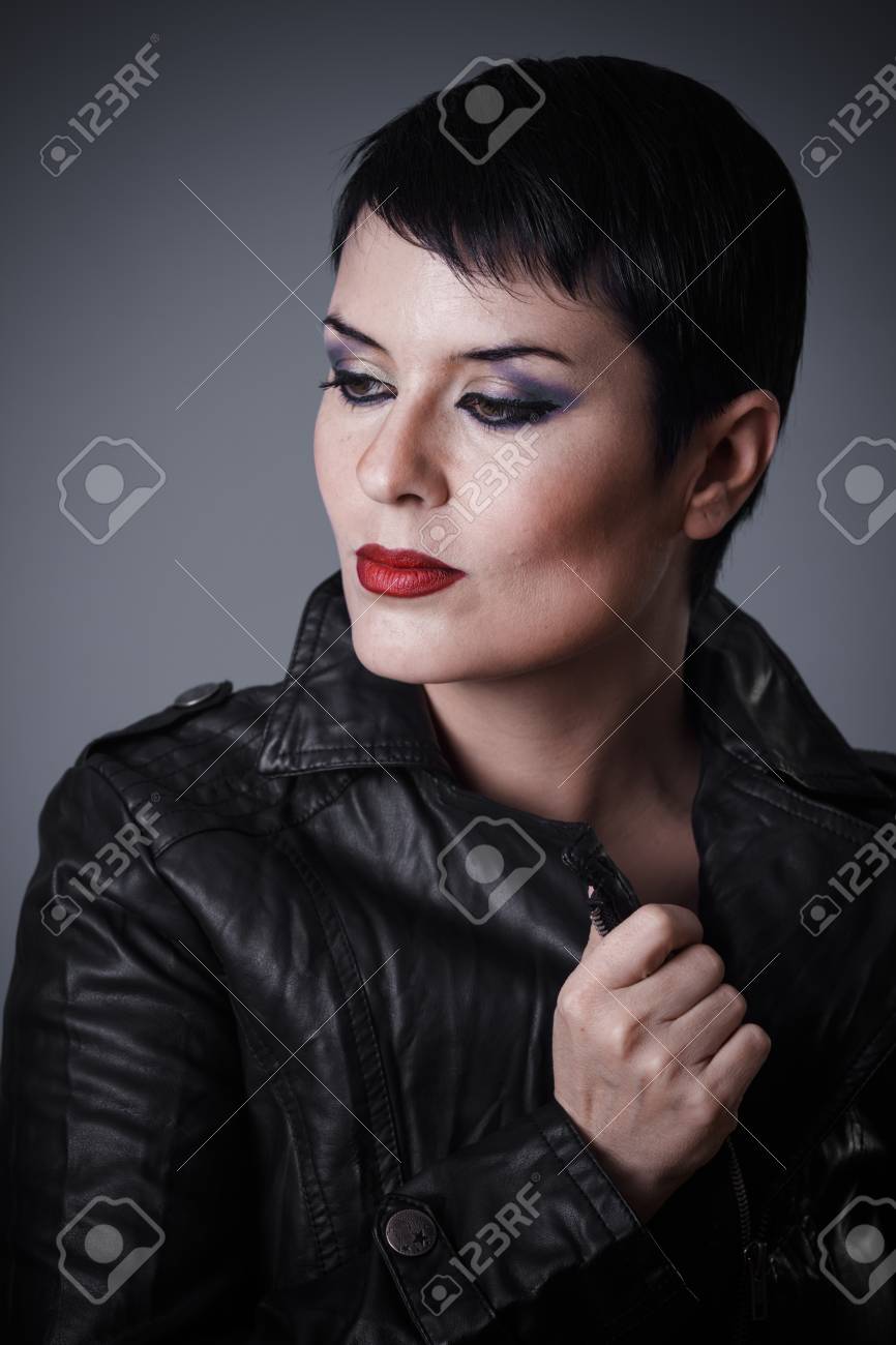 Brunette Woman Dressed In Leather Jacket Androgynous Appearance