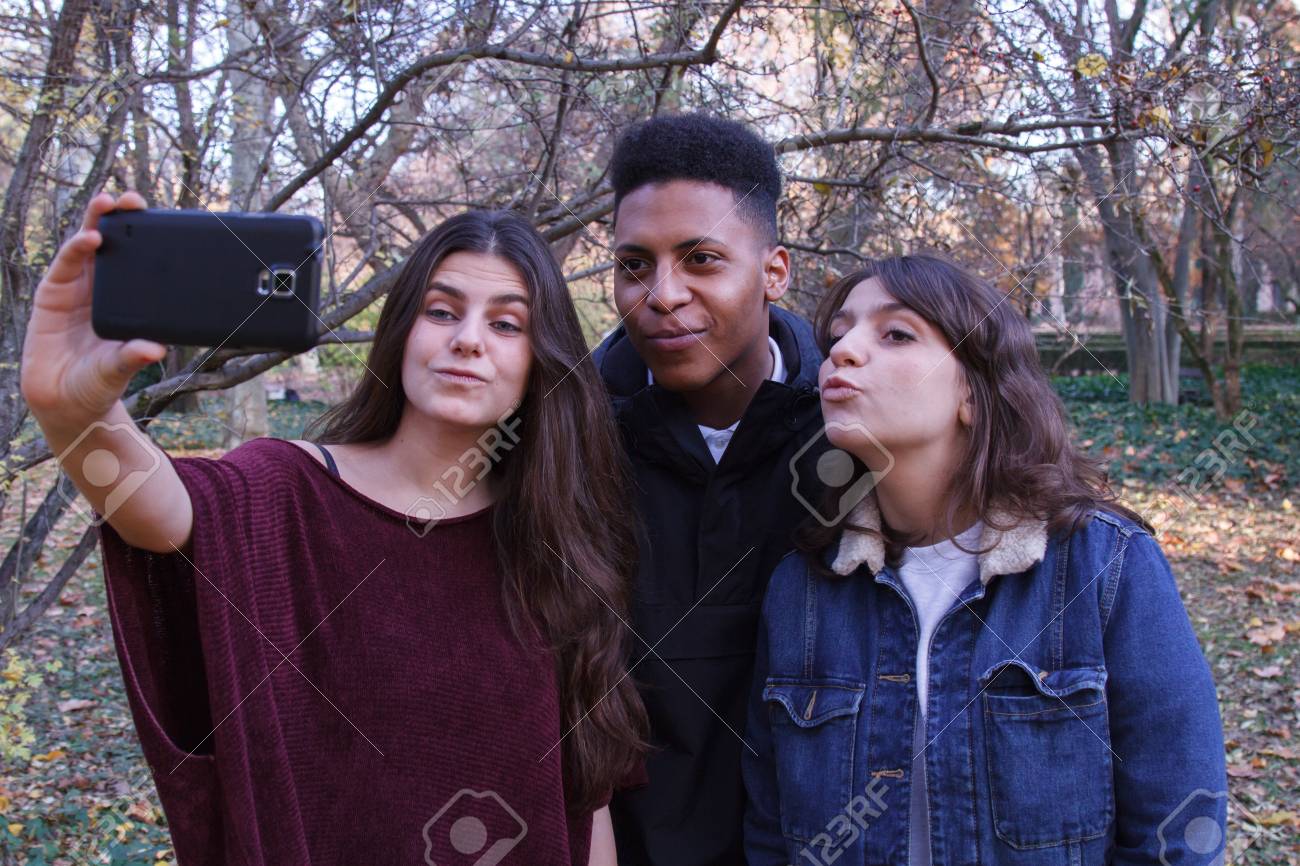 Group Of Young People Two Girls And A Black Caucasian Boy Doing Stock Photo Picture And Royalty Free Image Image Group Of Young People Two Girls And A Black Caucasian Boy Doing Stock Photo Picture And Royalty Free Image Image