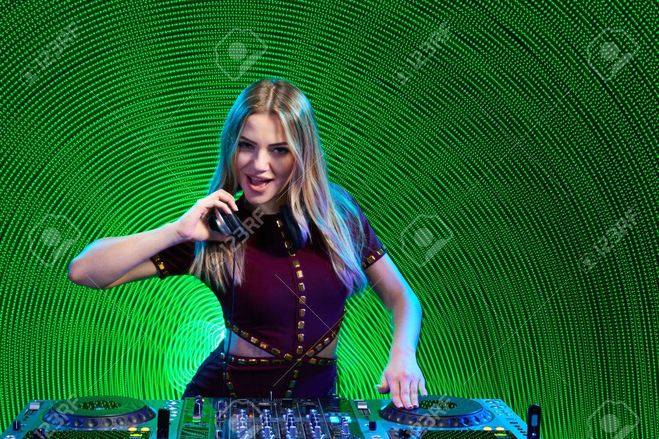 Beautiful DJ Girl On Playing Mixing Music On Vinyl Turntable At Party Over Green Led Background Stock Photo, Picture And Royalty Free Image. Image 58876565. Beautiful DJ Girl On Playing Mixing Music On Vinyl Turntable At Party Over Green Led Background Stock Photo, Picture And Royalty Free Image. Image 58876565.