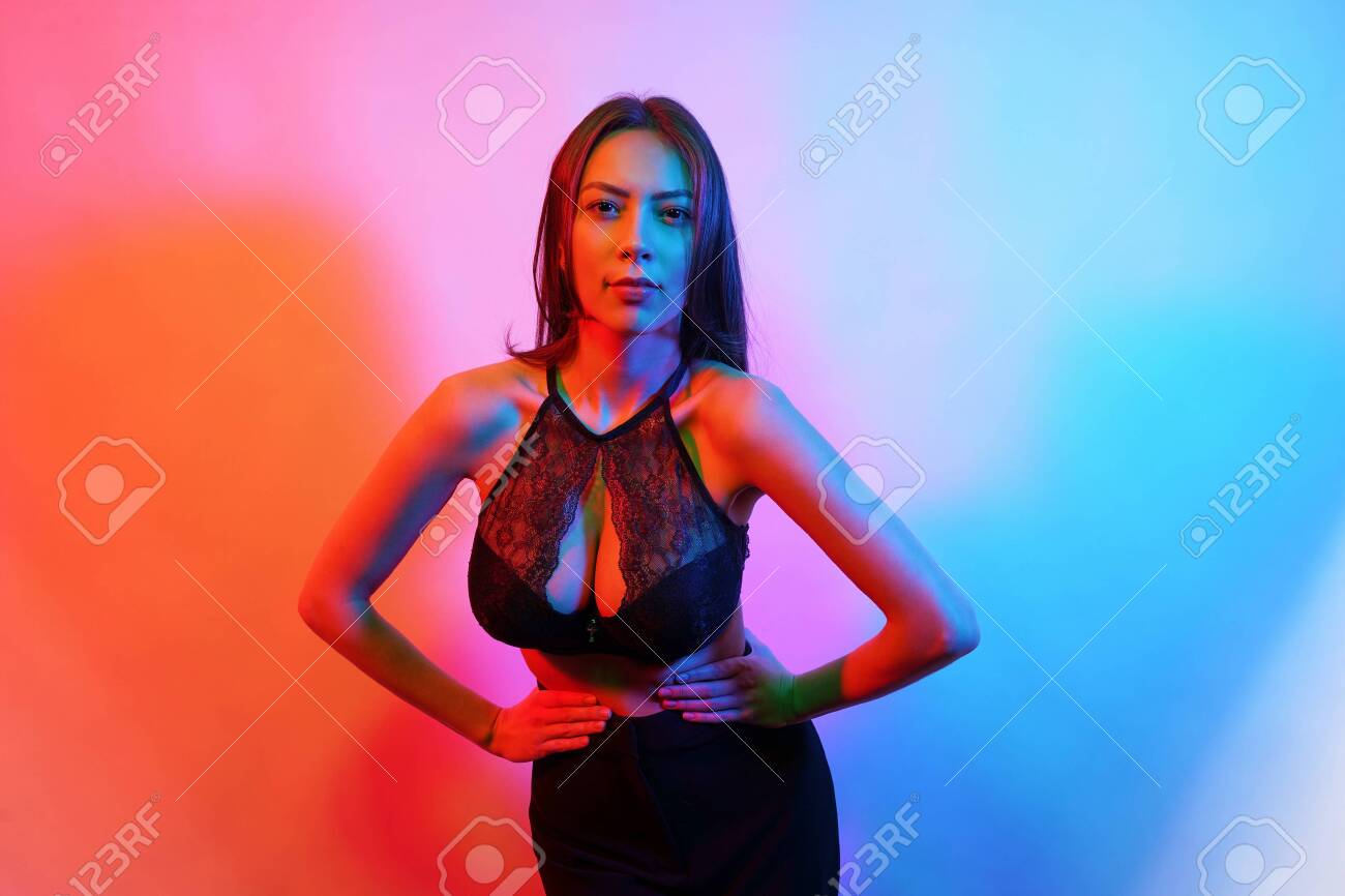 Close-up of a woman's brunette hair, styled in soft curls, illuminated by  natural-looking light Stock Photo - Alamy, image size:1300x866