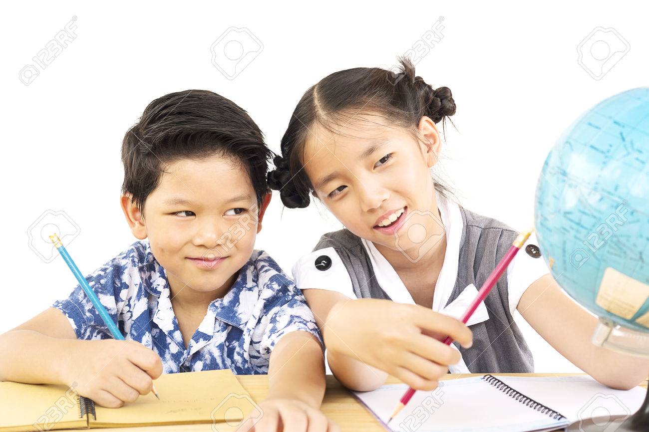 asian kids are studying the globe over white background stock photo