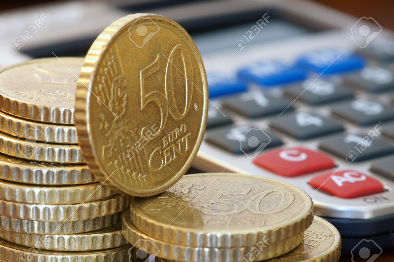 A Stack Of 50 Cents Euro Coins And A Calculator Stock P O 13585582 A Stack Of 50 Cents Euro Coins And A Calculator Stock P O 13585582