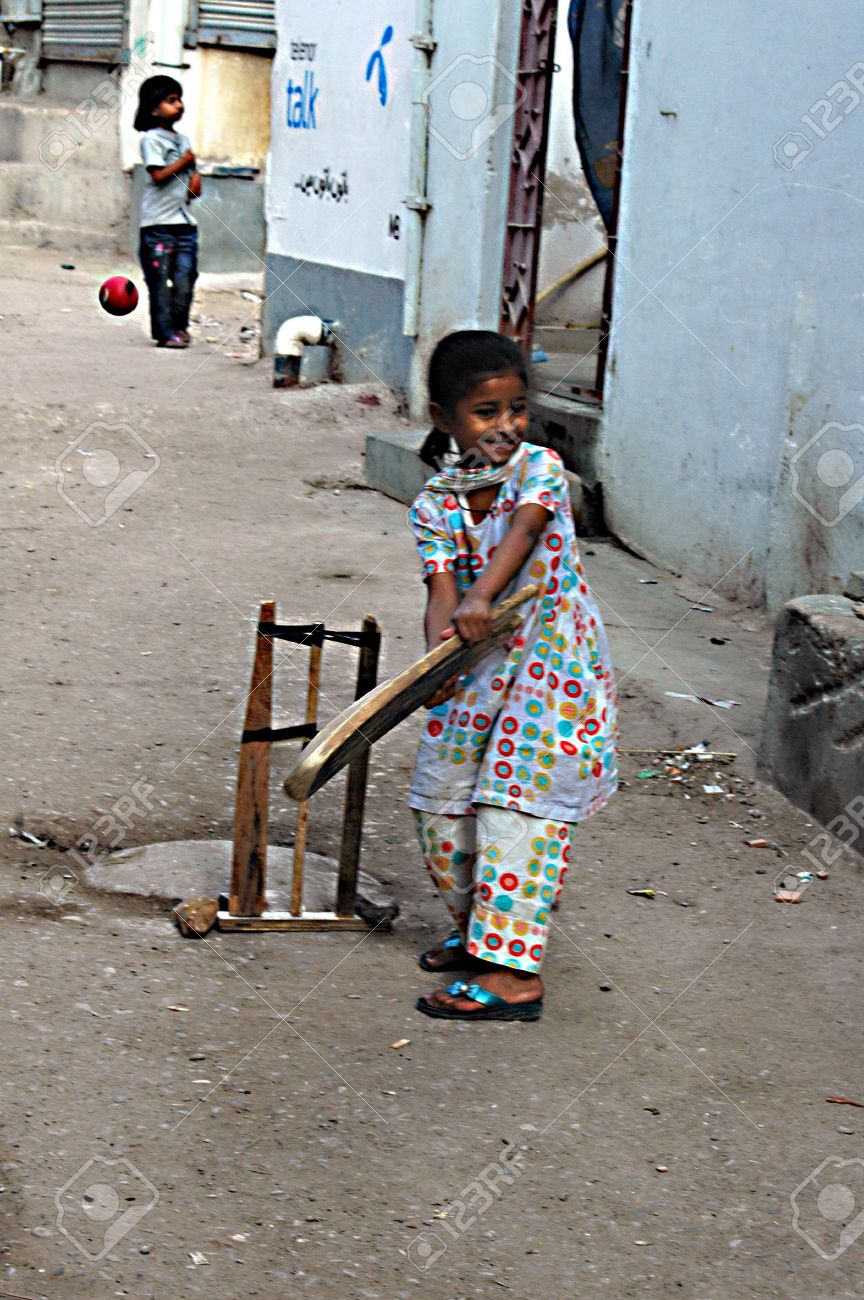 Karachi Pakistan_ Pakistani Christian Children Playing Cricket In Street Of Christian Area Azam Basti And Karachi Pakistan_ Pakistani Christian Children Playing Cricket In Street Of Christian Area Azam Basti And