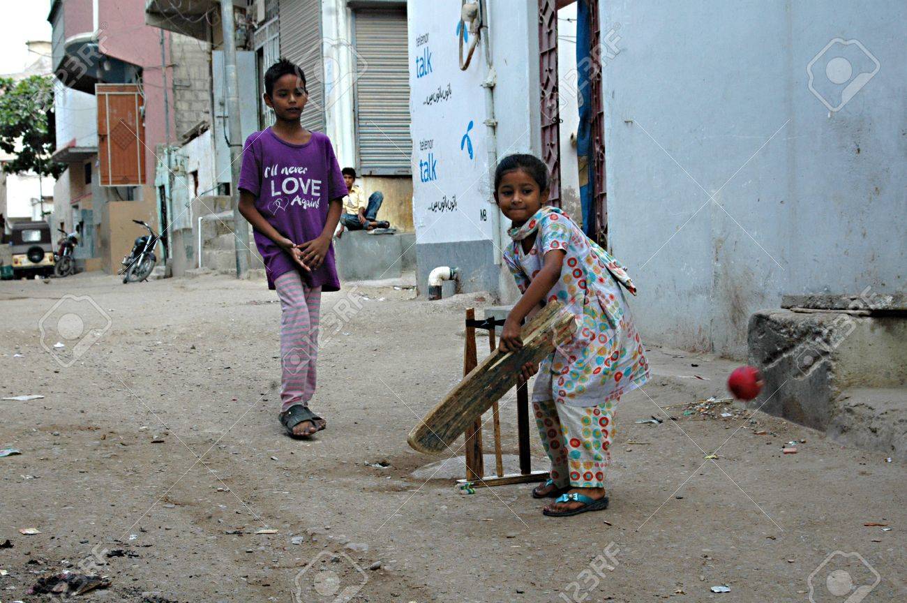 Karachi Pakistan_ Pakistani Christian Children Playing Cricket In Street Of Christian Area Azam Basti And Karachi Pakistan_ Pakistani Christian Children Playing Cricket In Street Of Christian Area Azam Basti And