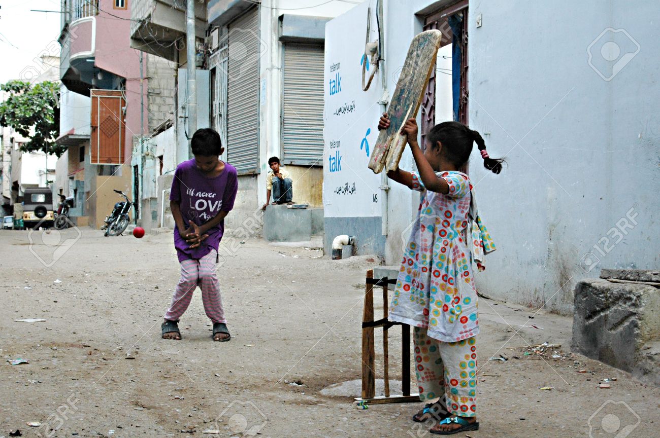 Karachi Pakistan_ Pakistani Christian Children Playing Cricket In Street Of Christian Area Azam Basti And Karachi Pakistan_ Pakistani Christian Children Playing Cricket In Street Of Christian Area Azam Basti And