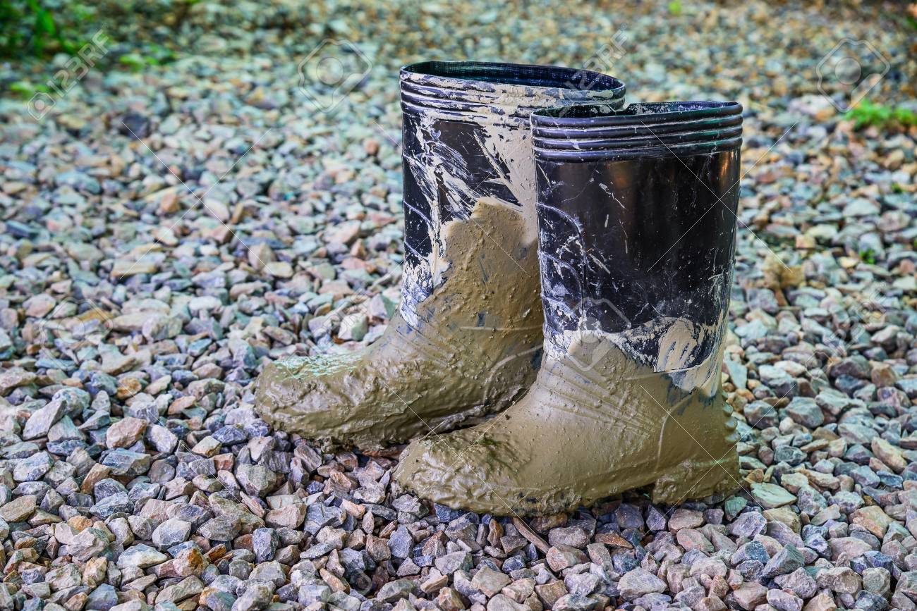 muddy rubber boots